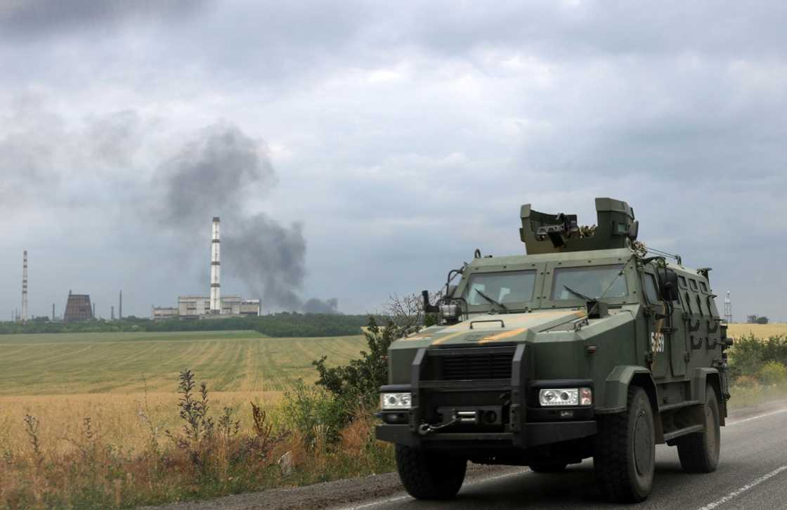 The road between Siversk and Bakhmut was busy with armoured personnel carriers, jeeps and ambulances