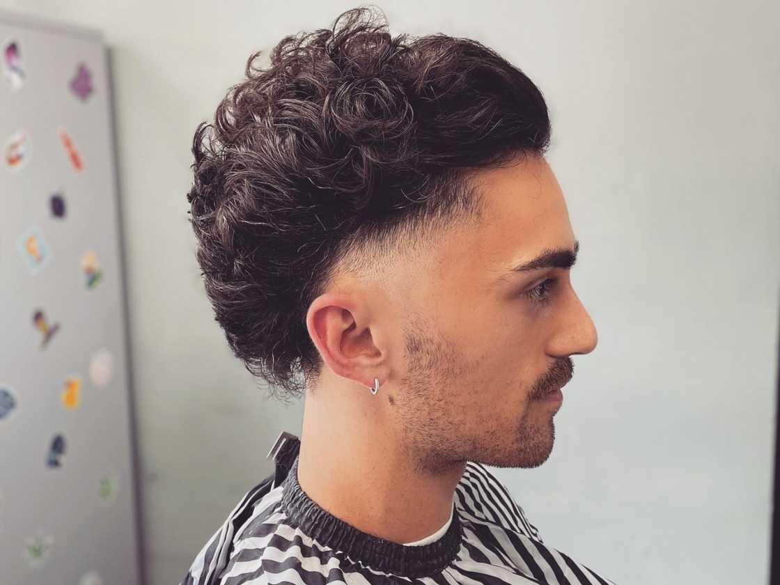 Tapered undercut mullet with stubble fade beard