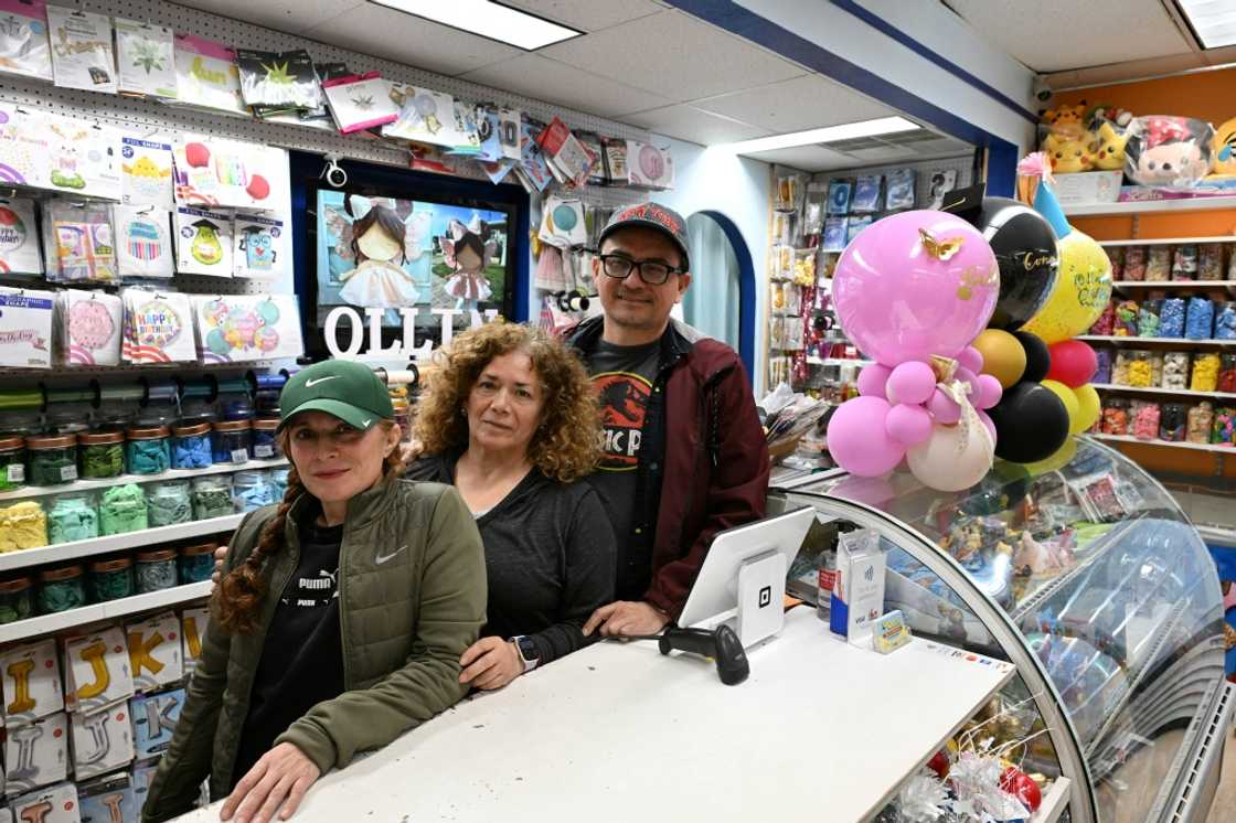 Patricia Loperena (L) poses for a photo with family members at their Ollin Party Store in the San Fernando Valley area of Los Angeles, where they are starting to feel the sting from Donald Trump's tariffs Patricia Loperena (L) poses for a photo with family members at their Ollin Party Store in the San Fernando Valley area of Los Angeles, where they are starting to feel the sting from Donald Trump's tariffs