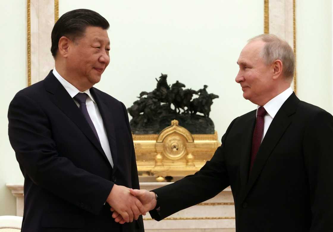 Vladimir Putin (R) and Xi Jinping held four and a half hours of talks Vladimir Putin (R) and Xi Jinping held four and a half hours of talks