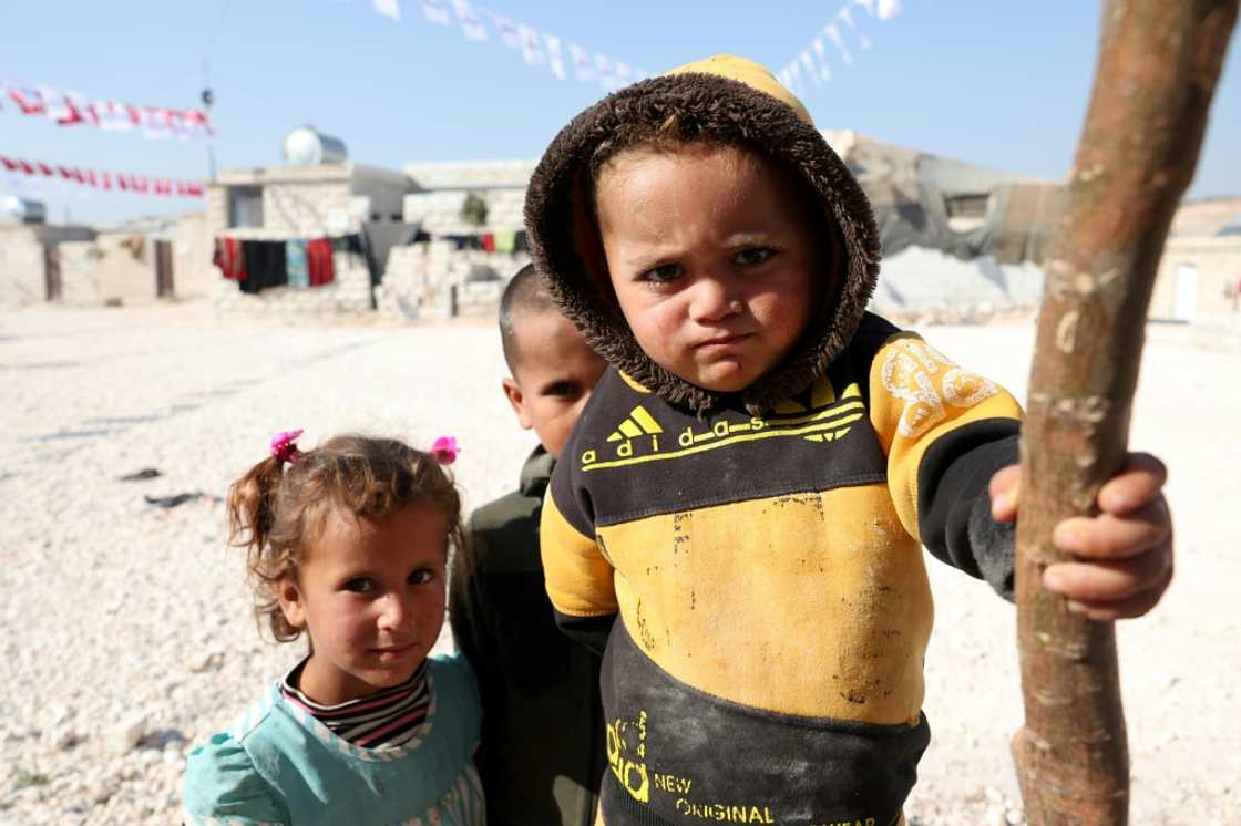 Displaced Syrians are pictured at a newly built housing complex constructed with Turkish support at Mashhad Ruhin,  in the Syrian rebel-held northwestern province of Idlib