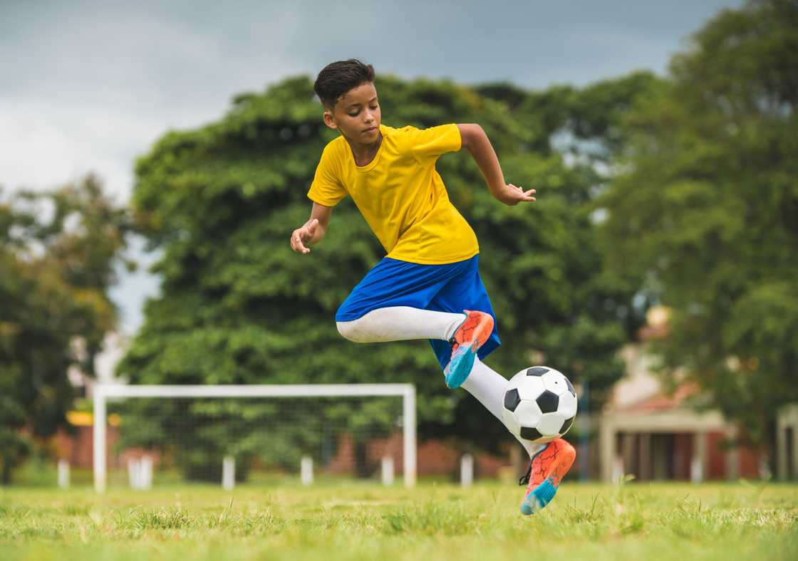 Brazilian kid playing soccer