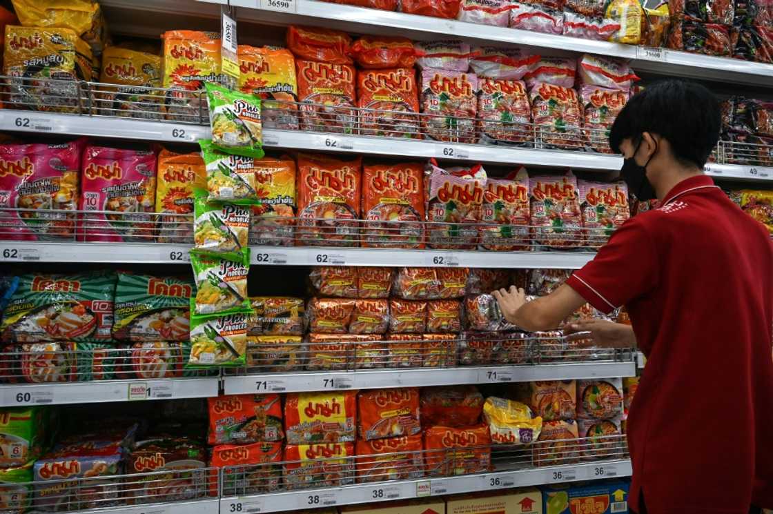 A shelf stocked with instant noodles at a Bangkok supermarket -- inflation has surged around the world A shelf stocked with instant noodles at a Bangkok supermarket -- inflation has surged around the world