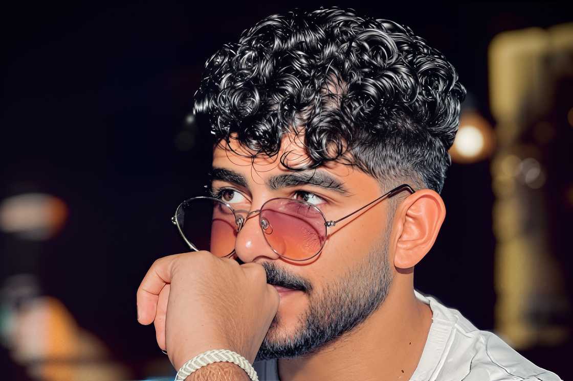 A cute black curly fringe hairstyle A cute black curly fringe hairstyle