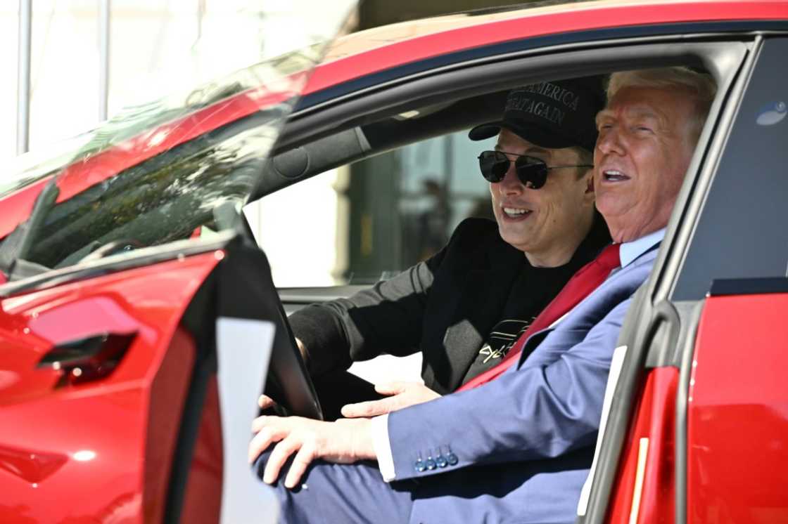 US President Donald Trump and Tesla CEO Elon Musk sit in a Tesla vehicle parked outside the White House US President Donald Trump and Tesla CEO Elon Musk sit in a Tesla vehicle parked outside the White House