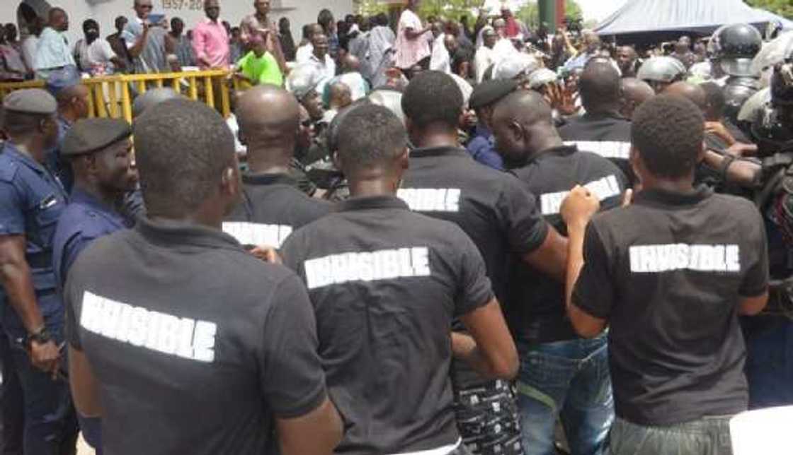 A group of men wearing black shirts A group of men wearing black shirts