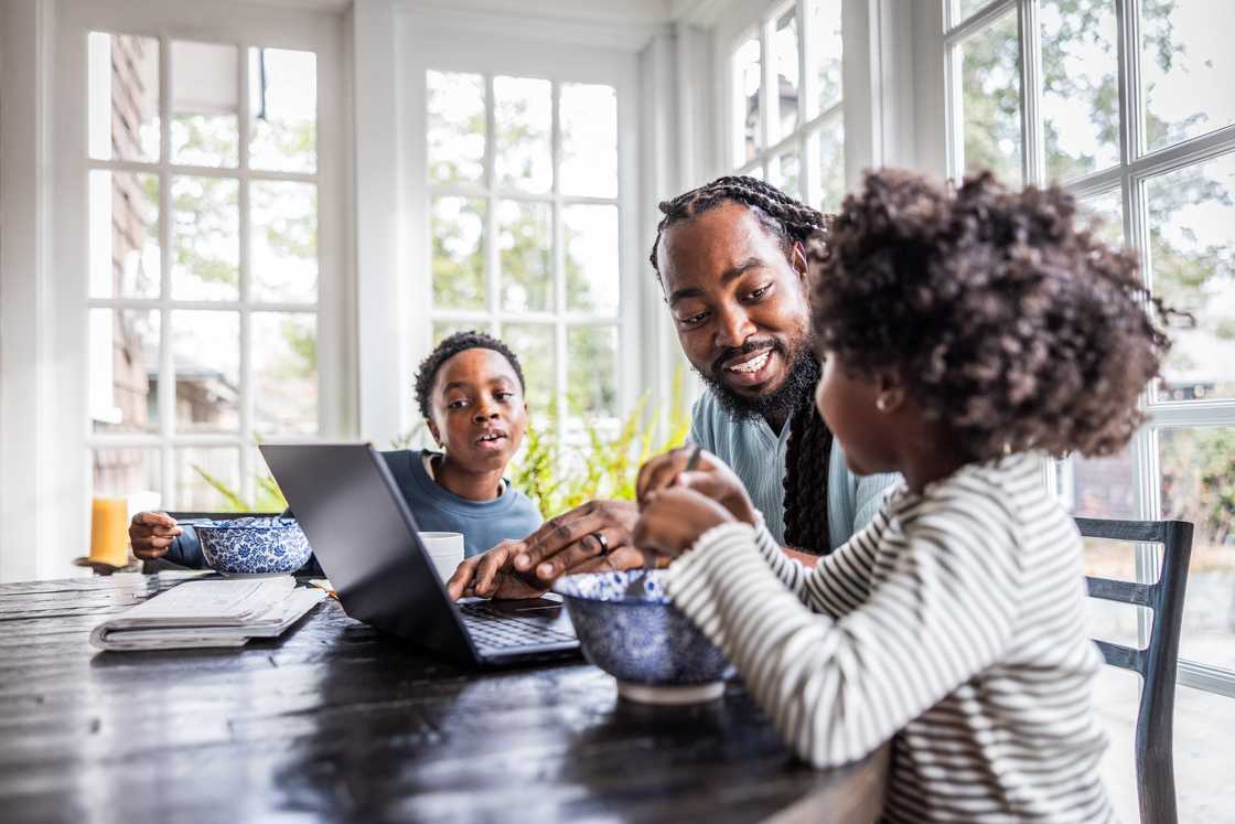 A father and his two kids bonding A father and his two kids bonding