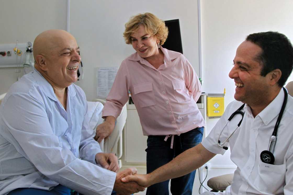 Lula (left) with his doctor and late wife Marisa Leticia during his cancer treatment in 2011 Lula (left) with his doctor and late wife Marisa Leticia during his cancer treatment in 2011