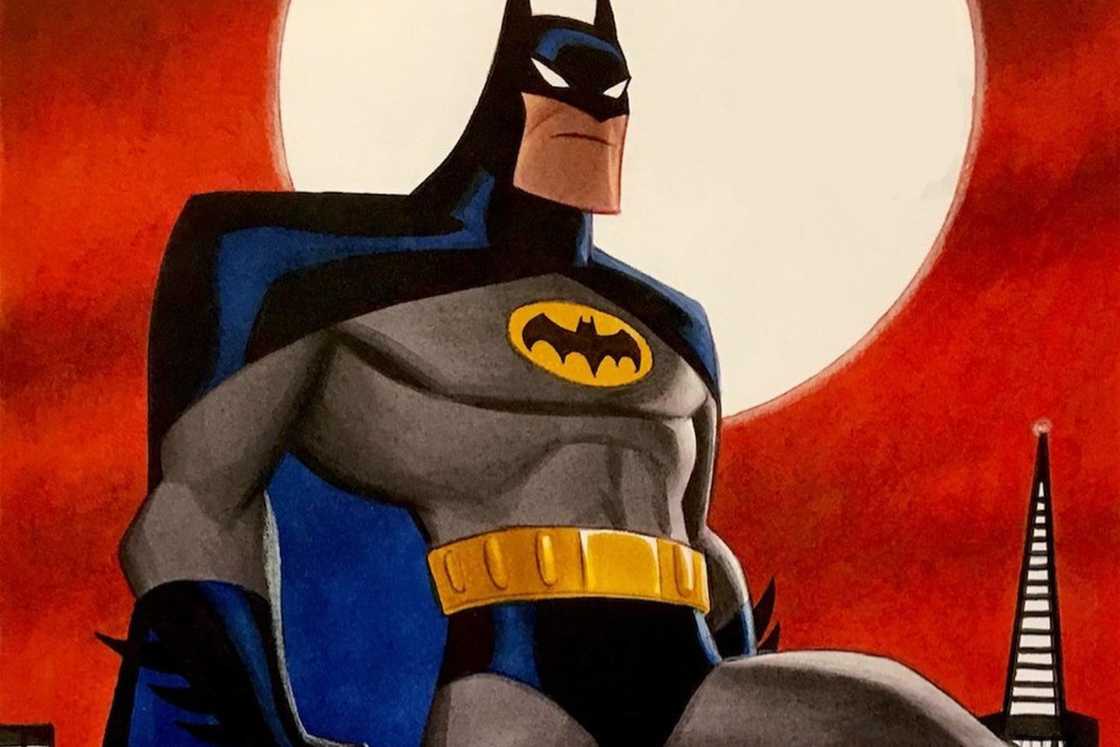 Batman cartoon is standing next to a big light