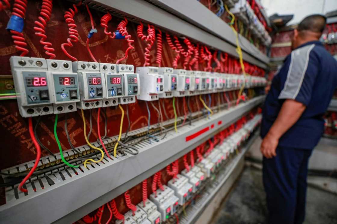 A generator technician monitors client switches in the eastern Sadr City suburb of Iraq's capital Baghdad A generator technician monitors client switches in the eastern Sadr City suburb of Iraq's capital Baghdad