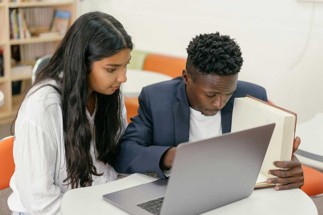 A male and female student working together