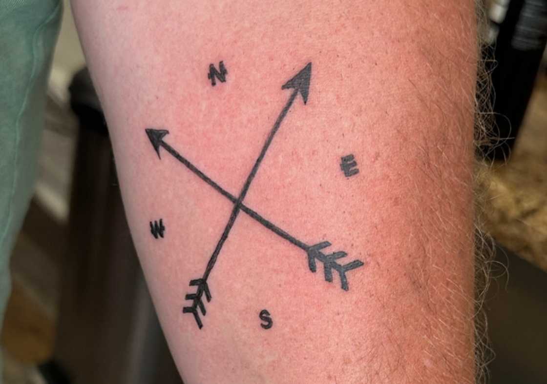 Crossed arrows tattoo