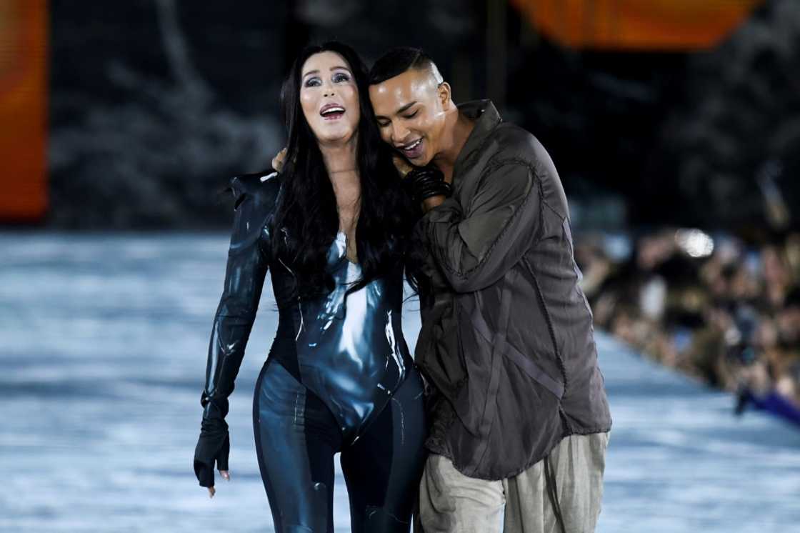 US singer Cher joined French designer Olivier Rousteing on the catwalk as her hit Strong Enough played US singer Cher joined French designer Olivier Rousteing on the catwalk as her hit Strong Enough played