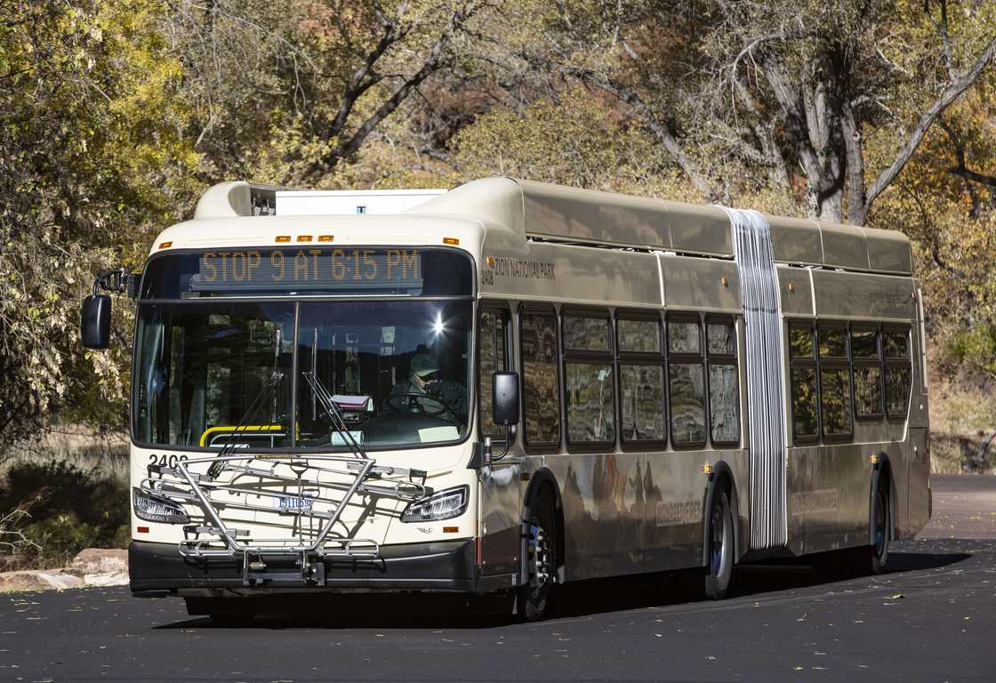 A shuttle bus arrives at the Zion Lodge in Zion National Park A shuttle bus arrives at the Zion Lodge in Zion National Park
