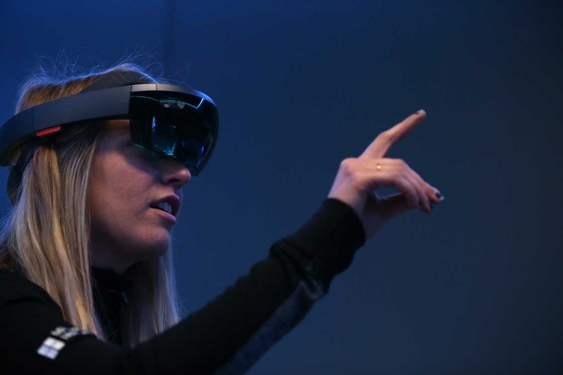 Microsoft HoloLens augmented reality gear has courted business or military users that can get a return on the investment, but has trimmed the unit as a part of recent budget tightening Microsoft HoloLens augmented reality gear has courted business or military users that can get a return on the investment, but has trimmed the unit as a part of recent budget tightening