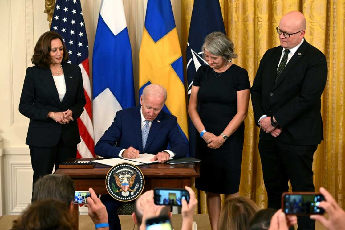 President Joe Biden flanked by Vice President Kamala Harris and the ambassadors of Sweden and Finland, says NATO expansion is a response to Russia's Ukraine invasion President Joe Biden flanked by Vice President Kamala Harris and the ambassadors of Sweden and Finland, says NATO expansion is a response to Russia's Ukraine invasion