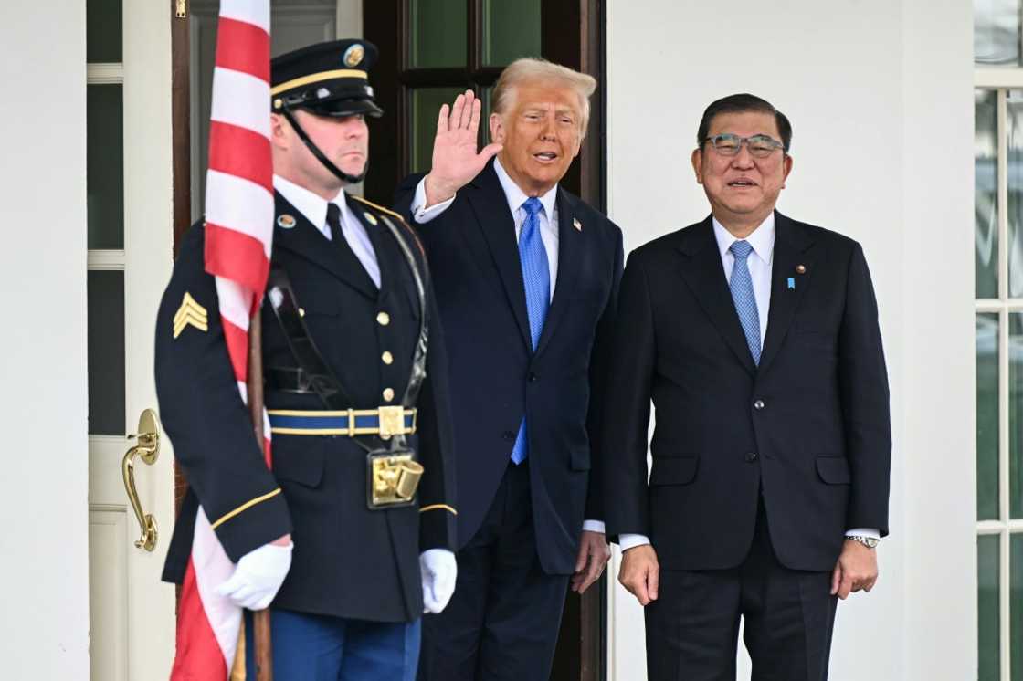 US President Donald Trump waves as he greets Japanese Prime Minister Shigeru Ishiba upon arrival outside the West Wing of the White House in Washington, DC, on February 7, 2025. US President Donald Trump waves as he greets Japanese Prime Minister Shigeru Ishiba upon arrival outside the West Wing of the White House in Washington, DC, on February 7, 2025.