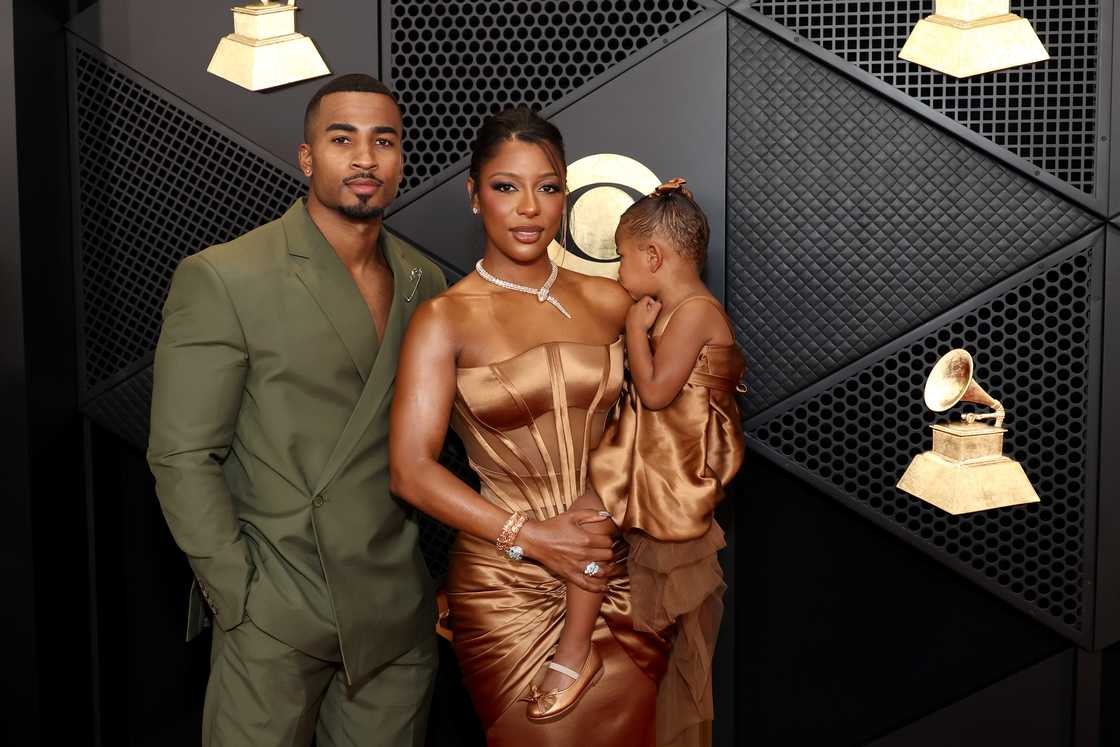 John Gaines, Victoria Monét and Hazel Monét attend the 66th GRAMMY Awards at Crypto.com Arena in Los Angeles, California. John Gaines, Victoria Monét and Hazel Monét attend the 66th GRAMMY Awards at Crypto.com Arena in Los Angeles, California.