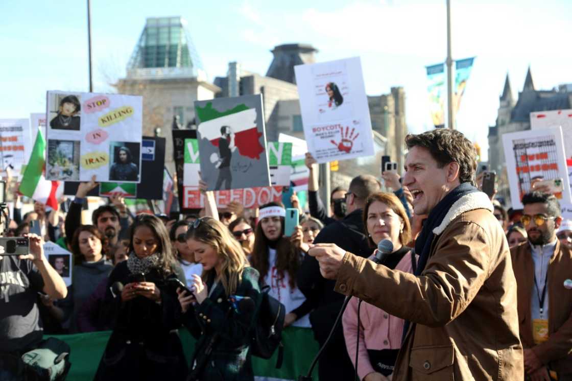 Canada's Prime Minister Justin Trudeau, shown here at a protest supporting Iranian women on October 29 2022 in Ottawa, said his government will continue to invest in safeguarding elections