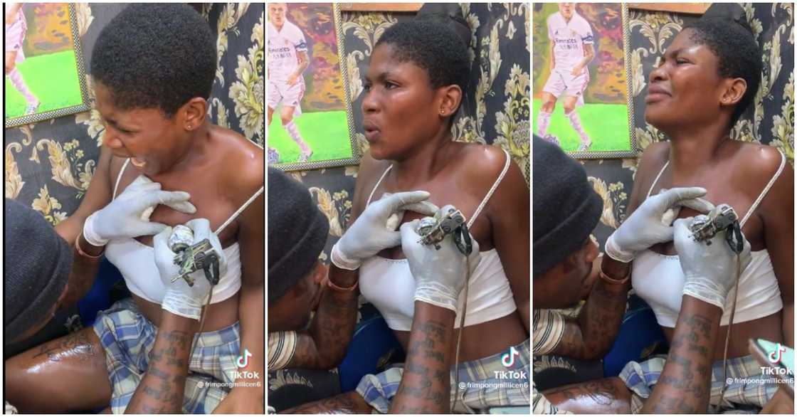 Photo of lady crying while getting a tattoo Photo of lady crying while getting a tattoo