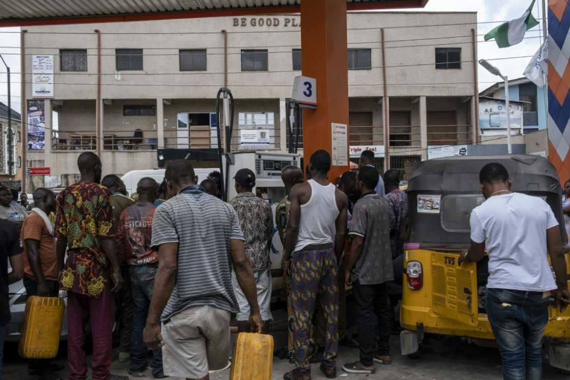 Nigerians grappled with widespread fuel scarcities and a hike in pump prices