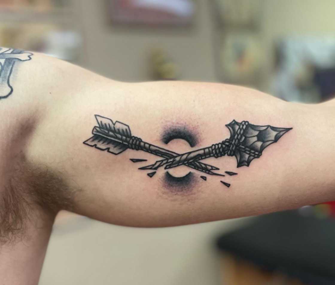 Broken arrow ankle tattoo