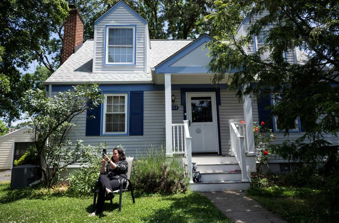 Julie McMurtry joins a zoom call with co-workers from her home in Arlington, Virginia Julie McMurtry joins a zoom call with co-workers from her home in Arlington, Virginia