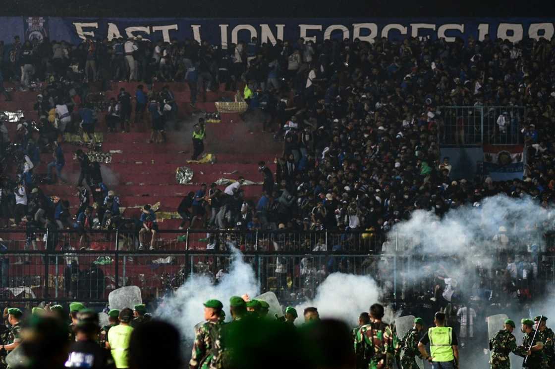 At least 127 people died at a football stadium in Indonesia when fans invaded the pitch and police responded with tear gas At least 127 people died at a football stadium in Indonesia when fans invaded the pitch and police responded with tear gas