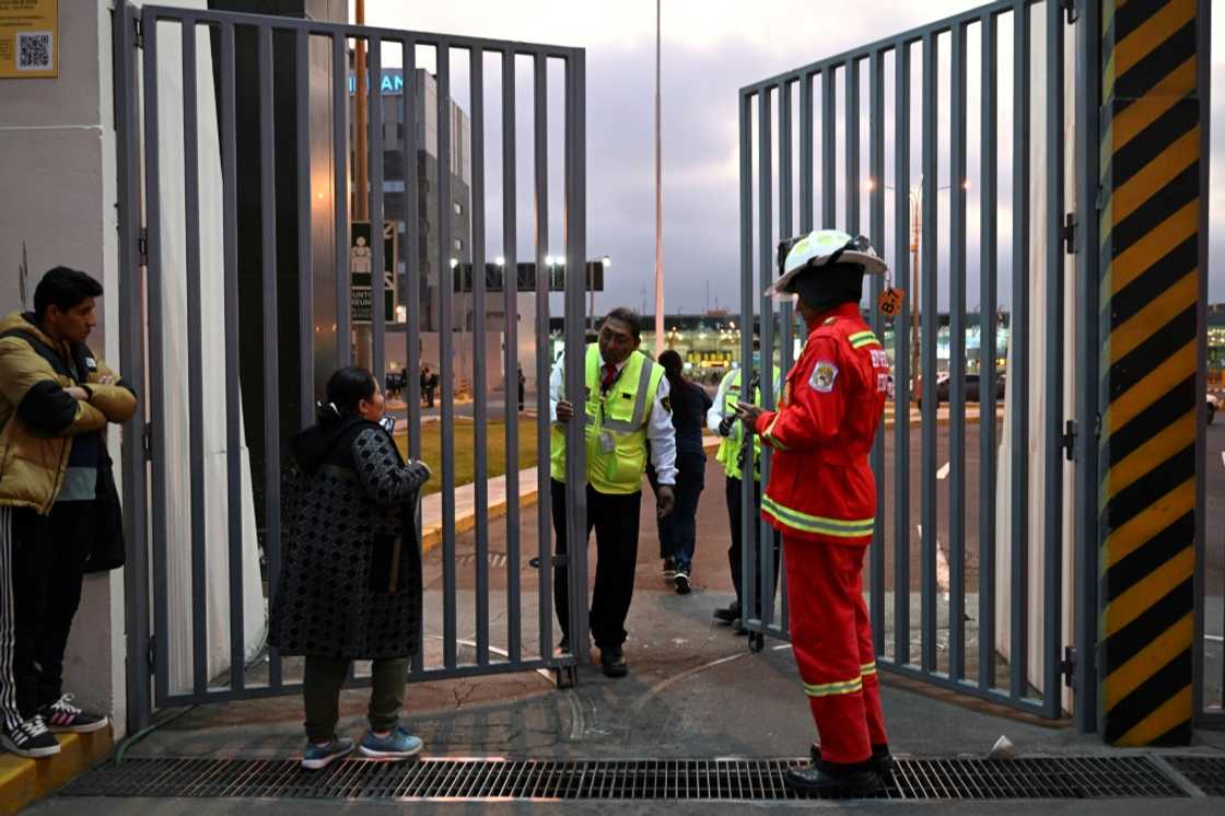 Passengers who missed their flights are seen outside the closed Lima airport after a collision between a plane and a fire truck on November 18, 2022 Passengers who missed their flights are seen outside the closed Lima airport after a collision between a plane and a fire truck on November 18, 2022