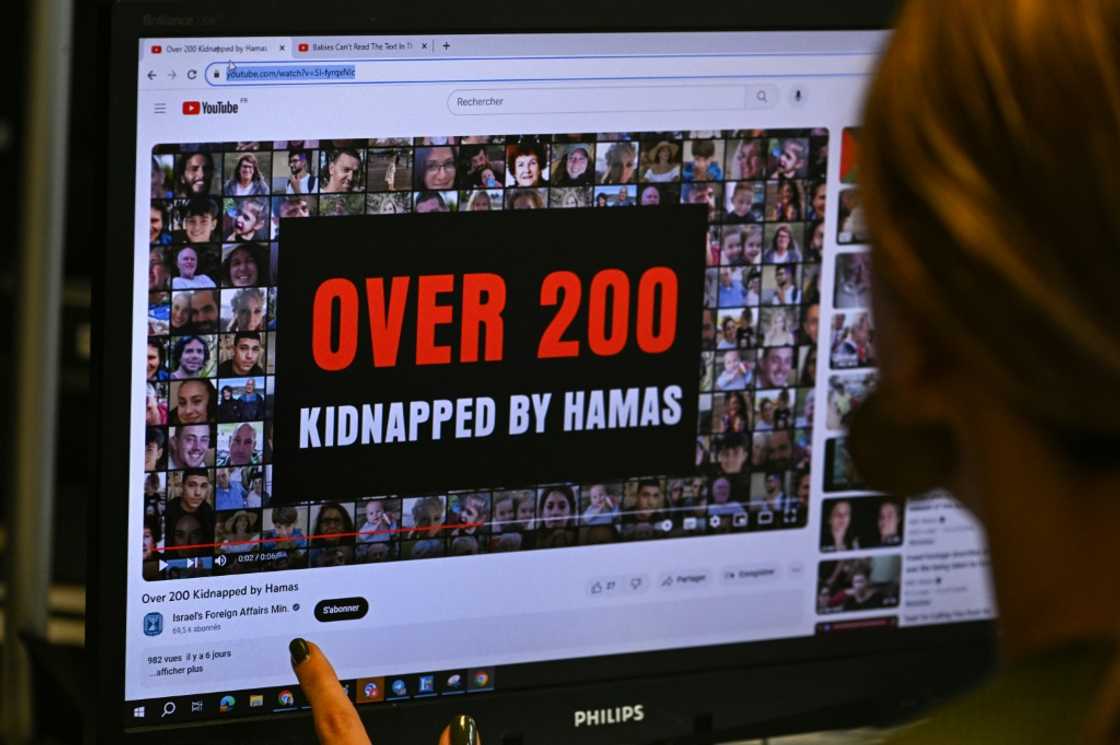This photograph taken on October 26, 2023, shows a woman looking at a computer screen in Paris, displaying an advertisement on the YouTube platform for a campaign financed by The Israeli Ministry of Foreign Affairs. Thousands of civilians, both Palestinians and Israelis, have died since October 7, 2023, after Palestinian Hamas militants based in the Gaza Strip entered southern Israel in an unprecedented attack triggering a war declared by Israel on Hamas with retaliatory bombings on Gaza. This photograph taken on October 26, 2023, shows a woman looking at a computer screen in Paris, displaying an advertisement on the YouTube platform for a campaign financed by The Israeli Ministry of Foreign Affairs. Thousands of civilians, both Palestinians and Israelis, have died since October 7, 2023, after Palestinian Hamas militants based in the Gaza Strip entered southern Israel in an unprecedented attack triggering a war declared by Israel on Hamas with retaliatory bombings on Gaza.