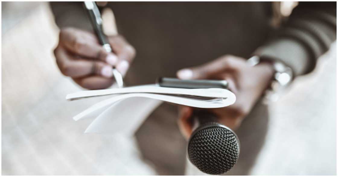 A man preparing to ask questions