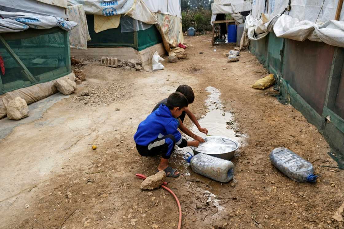 Amid an outbreak of cholera in the region, children rinse their hands at a camp for Syrian refugees in Talhayat, Lebanon Amid an outbreak of cholera in the region, children rinse their hands at a camp for Syrian refugees in Talhayat, Lebanon