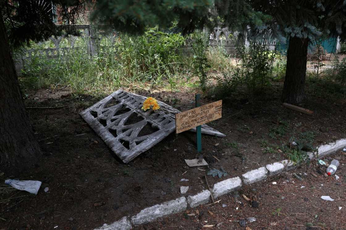 Oleksy's grave was dug hastily, on the sidewalk near one of the few buildings still standing in Siversk Oleksy's grave was dug hastily, on the sidewalk near one of the few buildings still standing in Siversk