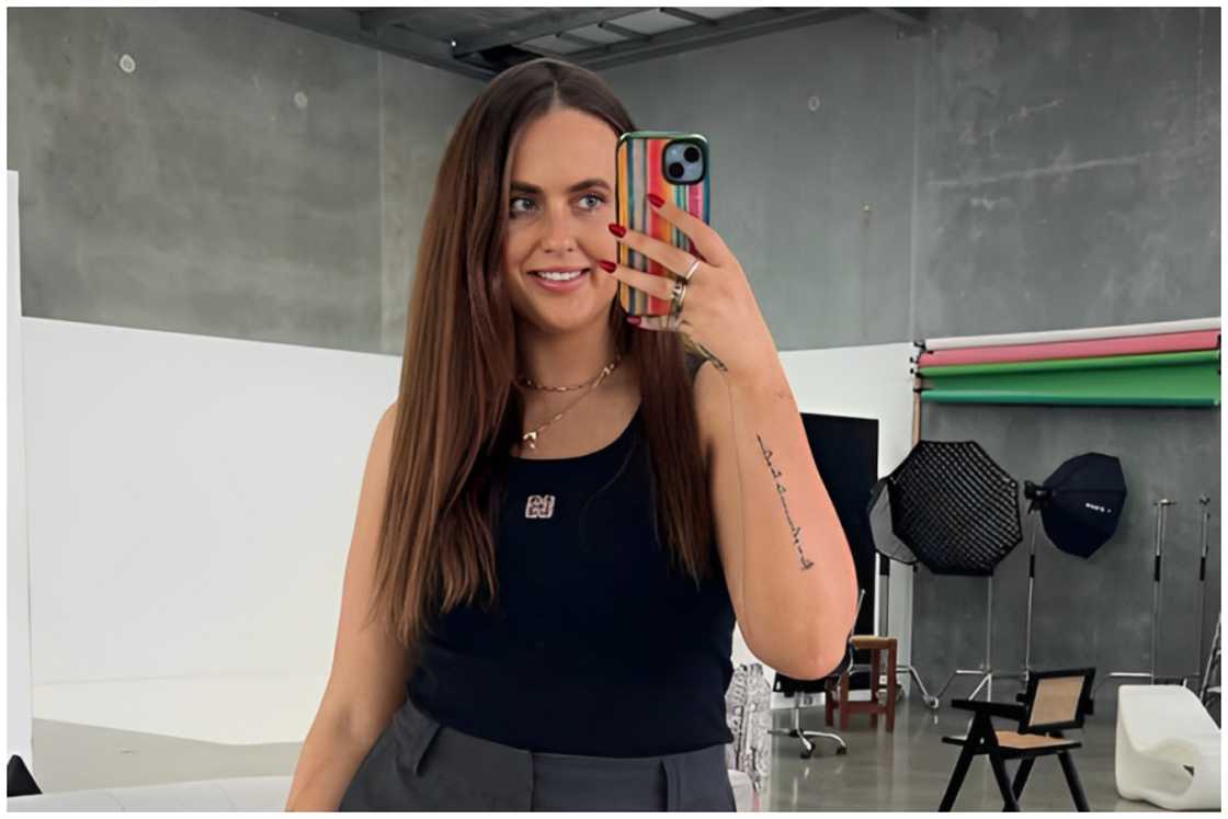 Tyler Mahoney holding a phone. Tyler Mahoney holding a phone.