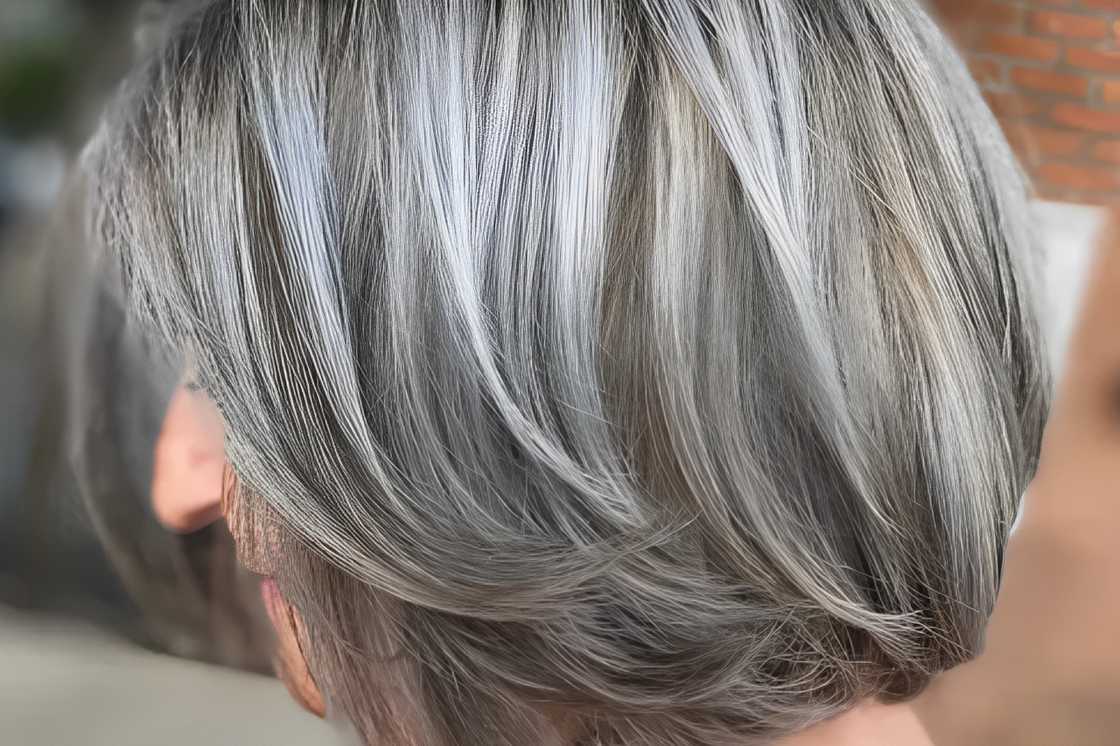 A white woman is rocking a metallic mushroom bob style A white woman is rocking a metallic mushroom bob style