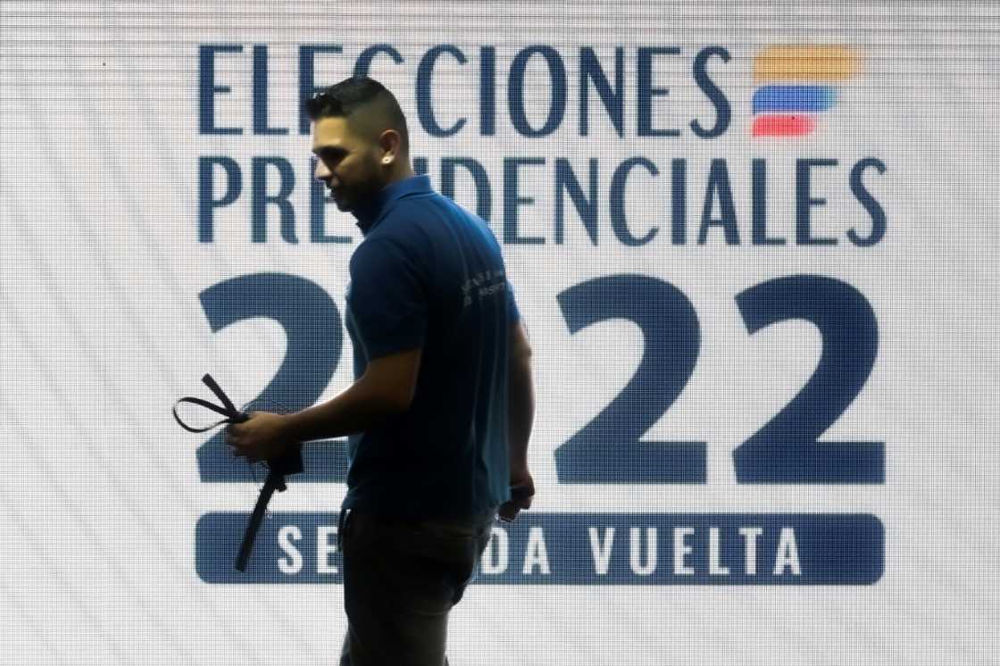 A man works at a polling station in Bogota, on June 18, 2022, a day before the presidential runoff election A man works at a polling station in Bogota, on June 18, 2022, a day before the presidential runoff election