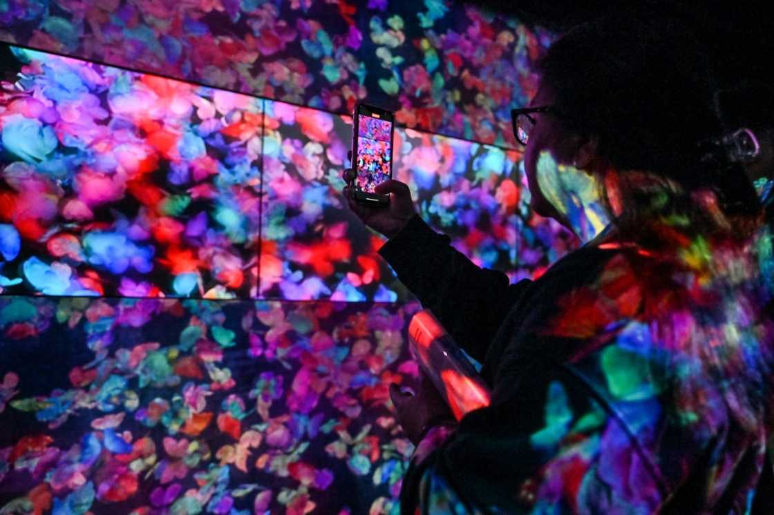 Visitors to the attraction at Azabudai Hills, which has towered over central Tokyo since its completion last year, are free to wander through the complex of artworks that combine projection and sound Visitors to the attraction at Azabudai Hills, which has towered over central Tokyo since its completion last year, are free to wander through the complex of artworks that combine projection and sound