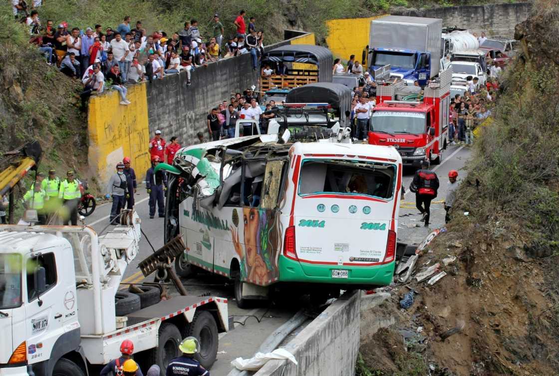 At least 20 people died and 15 others were injured on October 15, 2022 when a bus overturned near a cliff on the Pan-American Highway in southwestern Colombia, police said At least 20 people died and 15 others were injured on October 15, 2022 when a bus overturned near a cliff on the Pan-American Highway in southwestern Colombia, police said