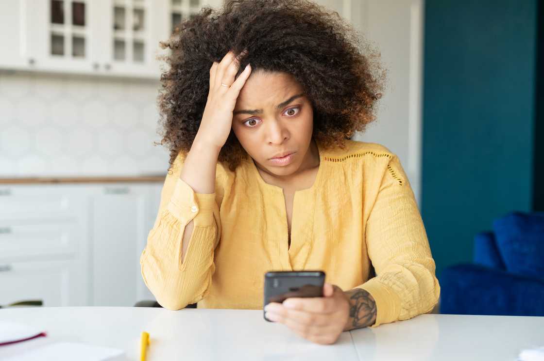 A lady stressed over a call A lady stressed over a call