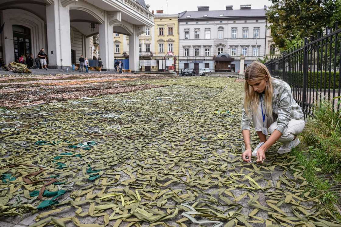 A woman makes camouflage nets for the Ukrainian military in Lviv A woman makes camouflage nets for the Ukrainian military in Lviv