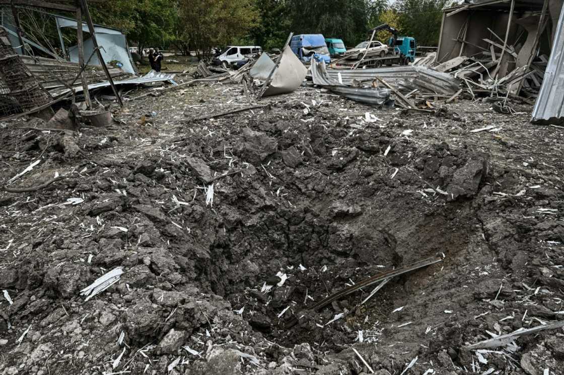 The deadly attack came in the morning, when hundreds of people were waiting to cross into the Russian-controlled part of the region The deadly attack came in the morning, when hundreds of people were waiting to cross into the Russian-controlled part of the region