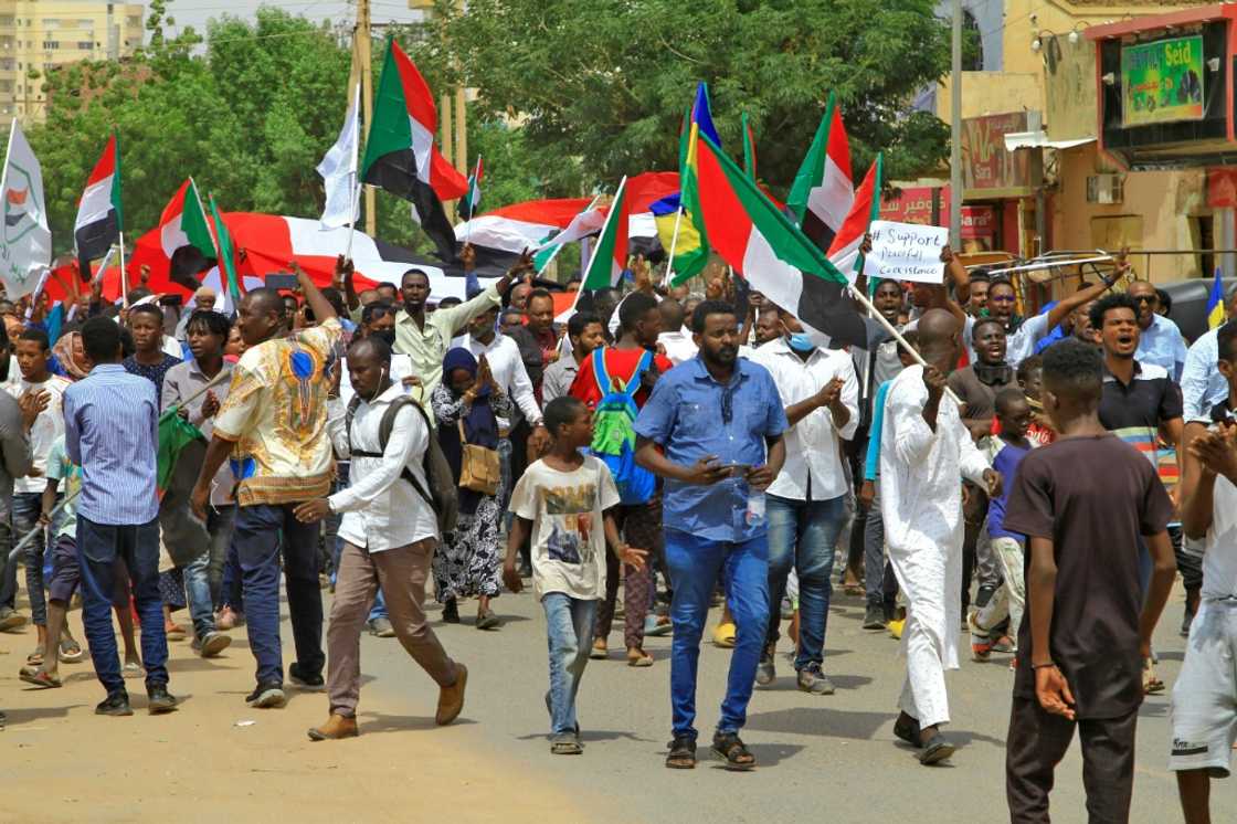 Protesters waving national flags march in an anti-coup demonstration in southern Khartoum on July 26, 2022 Protesters waving national flags march in an anti-coup demonstration in southern Khartoum on July 26, 2022