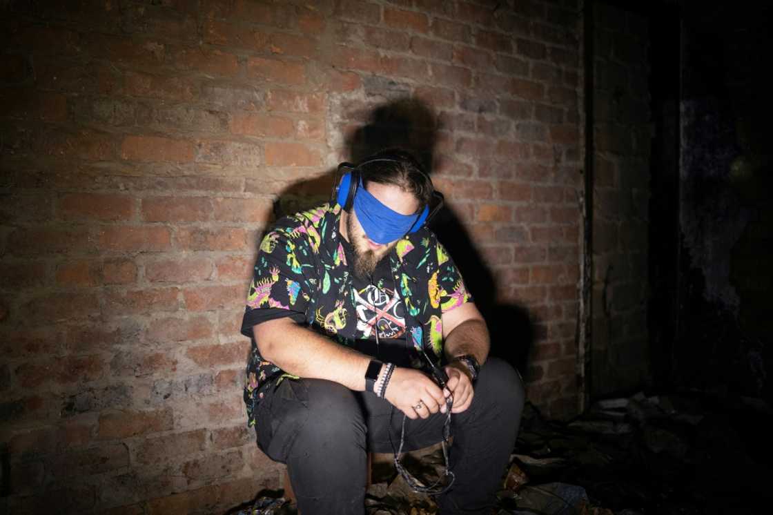 Members of the Upsidedown group scout haunted buildings looking for clues in cavernous hallways and rusting stairwells Members of the Upsidedown group scout haunted buildings looking for clues in cavernous hallways and rusting stairwells