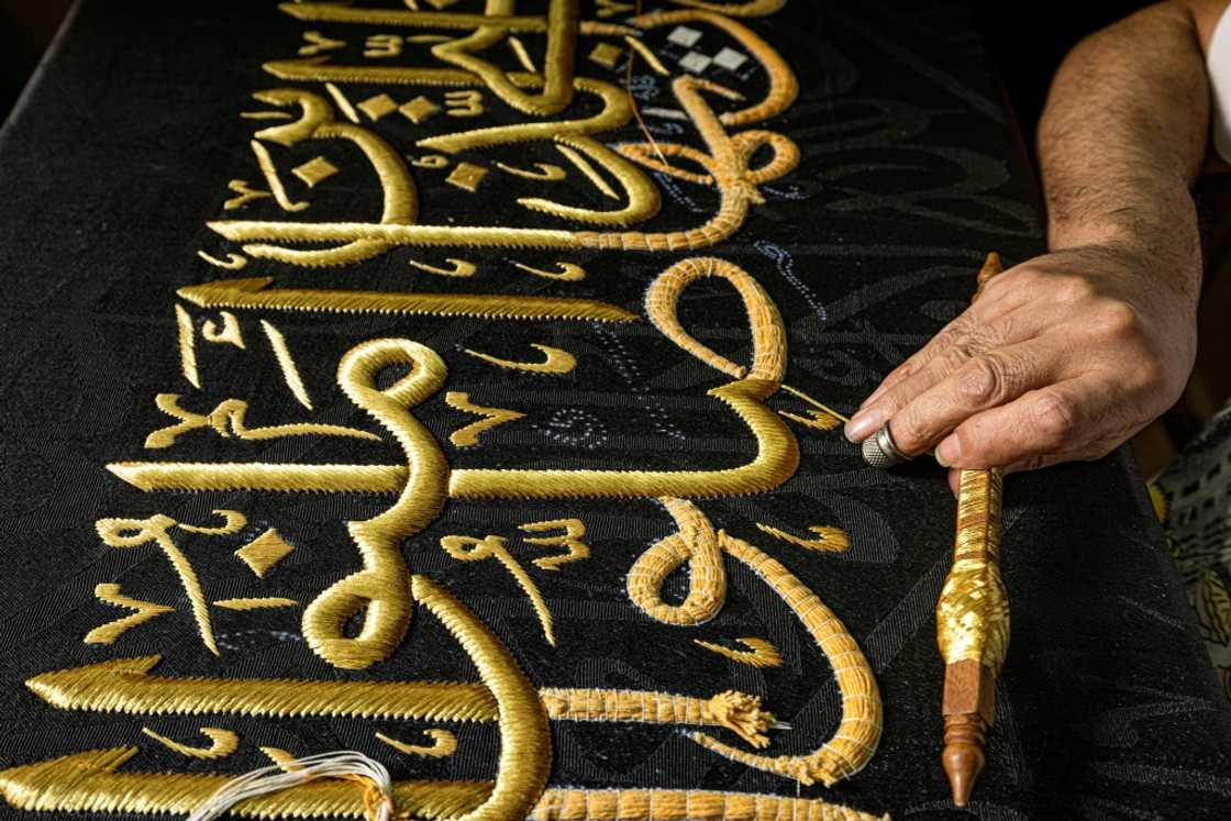 From the 13th century, Egyptian artisans made the kiswa, the giant black cloth that covers the Kaaba in Mecca's Grand Mosque From the 13th century, Egyptian artisans made the kiswa, the giant black cloth that covers the Kaaba in Mecca's Grand Mosque