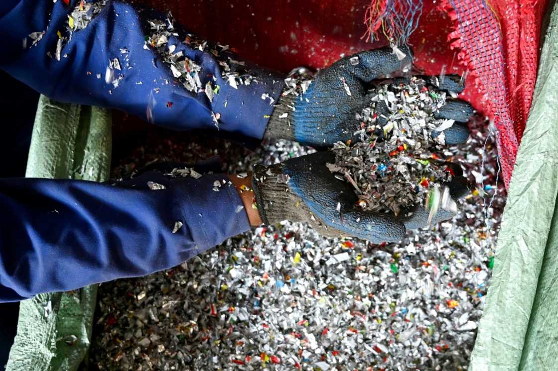A worker sorts shredded recyclable plastic waste at the Green Road Waste Management processing facility in Pokhara A worker sorts shredded recyclable plastic waste at the Green Road Waste Management processing facility in Pokhara