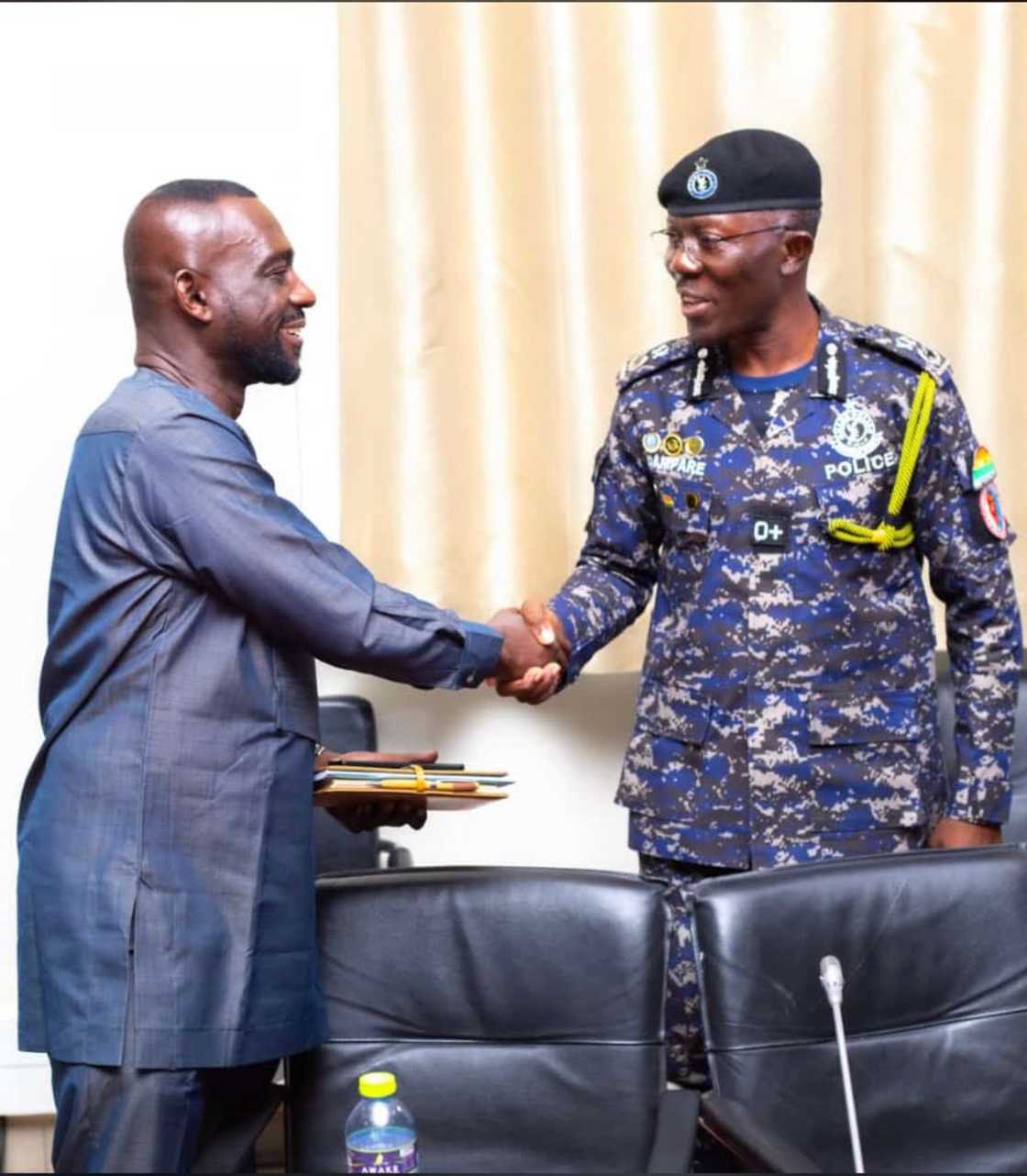Dampare shakes the hand of COP George Alex Mensah. Dampare shakes the hand of COP George Alex Mensah.