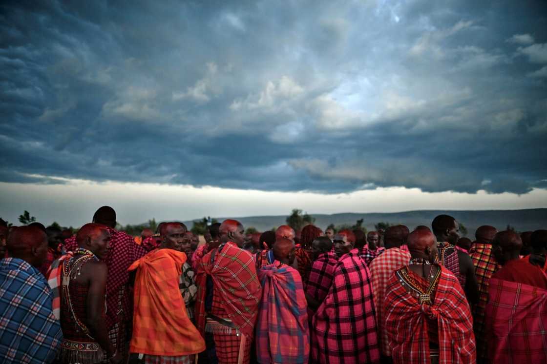 Maasai men gather to observe a traditional rite of passage last year at the Masai-Mara National Reserve