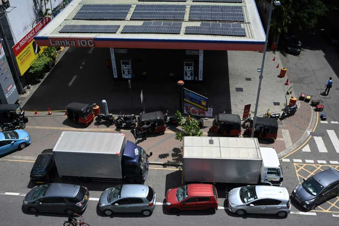 Even amid protests that saw the presidential residence stormed, many in Colombo refused to abandon their place in fuel queues