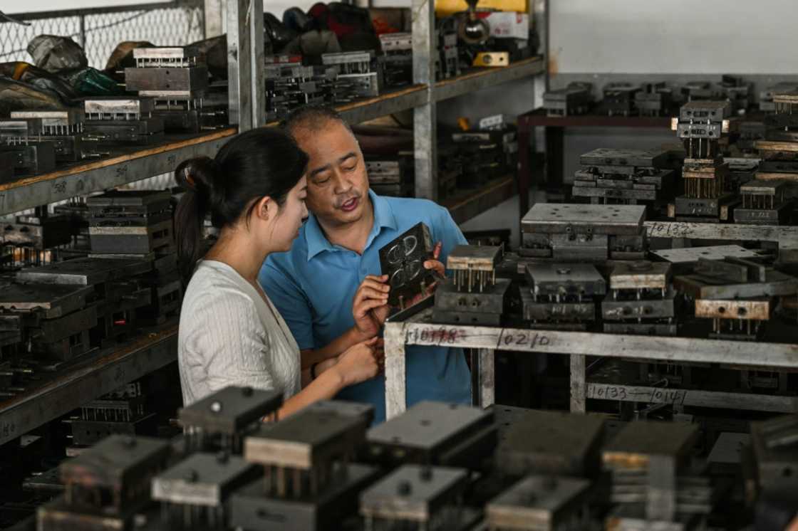 Qiu (with her father in their metal parts factory) has set up a marketing business that directly connects factories with foreign audiences via Instagram and TikTok videos