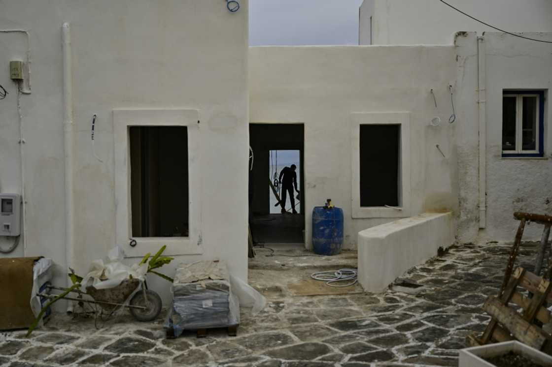 Workers busy on a site on the Greek island of Paros Workers busy on a site on the Greek island of Paros